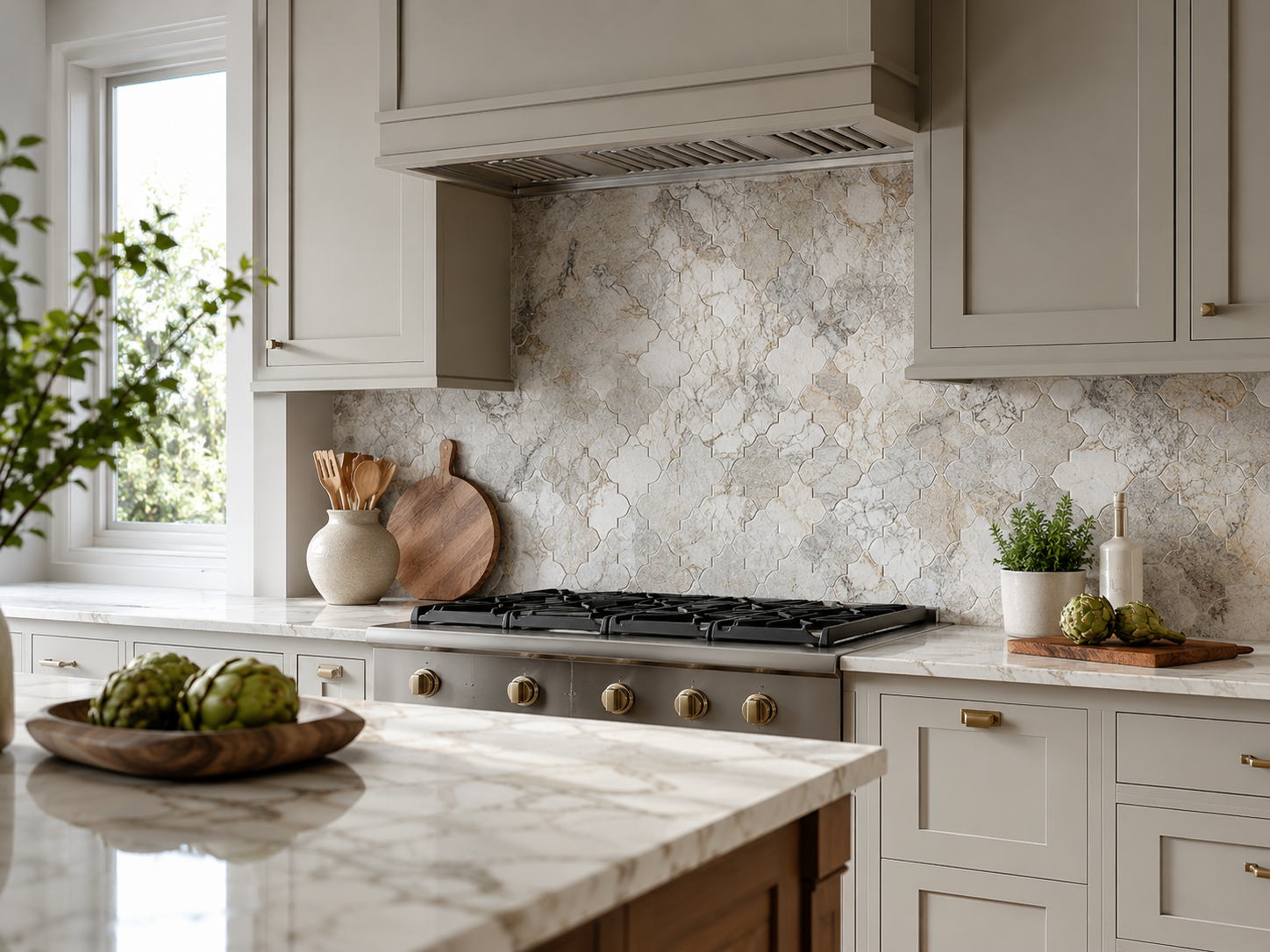 Modern white kitchen with natural stone backsplash tile, clean countertop, warm lighting, and timeless American interior design